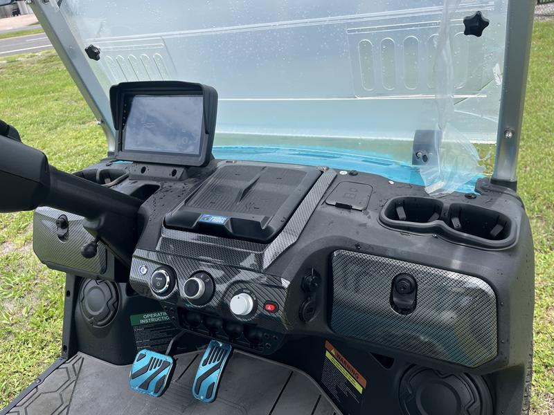 Dashboard interior of 2025 Evolution D-Max GT4 Sky Blue golf cart with export options and nationwide delivery