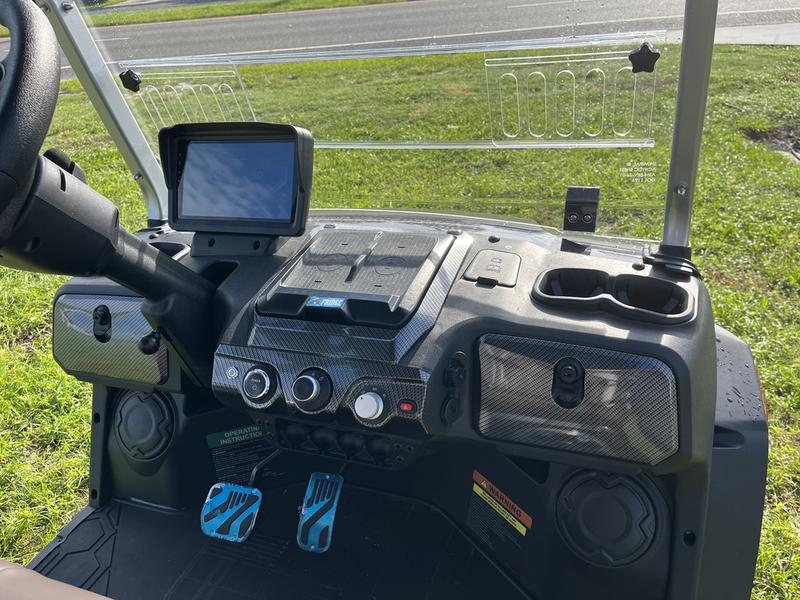 Dashboard interior of 2025 Evolution D-Max XT6 black golf cart available in Pennsylvania