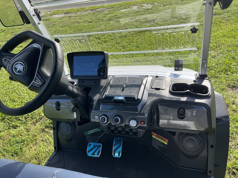 Dashboard and interior of 2025 Evolution D-Max XT6 white electric golf cart available in Michigan