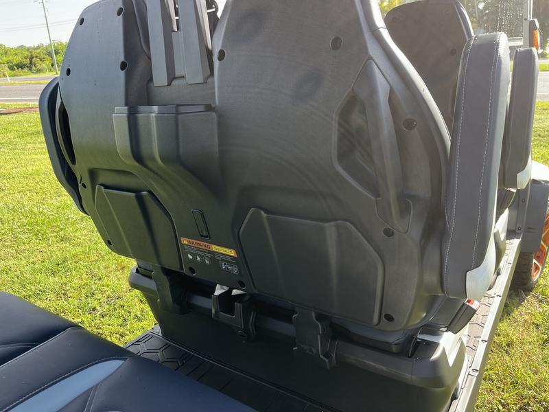 Seating layout of 2025 Evolution D-Max XT6 white, six-passenger electric golf cart available in Michigan