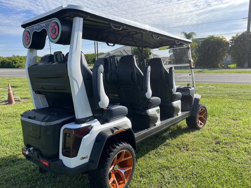 Rear view of 2025 Evolution D-Max XT6 white electric golf cart available in Michigan