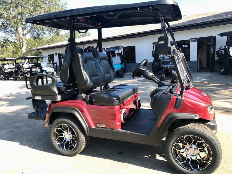 Side profile of 2025 Evolution D5-Ranger 2+2 Plus Red golf cart available in North Carolina