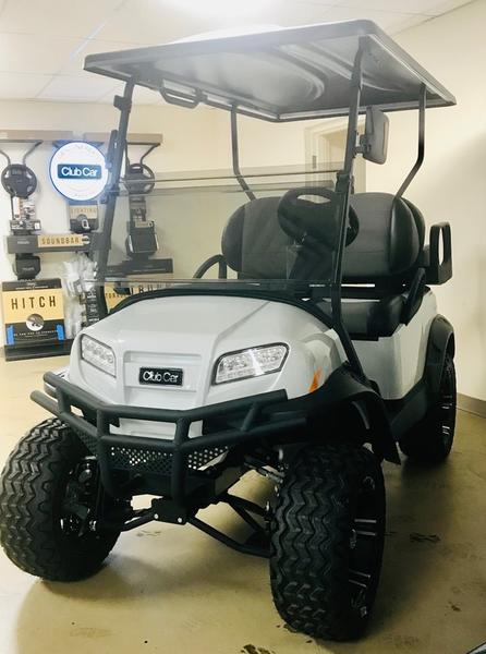 Side view of 2025 Club Car Onward Lifted 4 Passenger XR Lithium golf cart in Orlando Florida