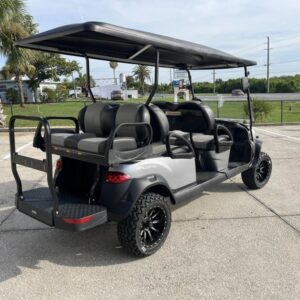 Side view of 2026 Club Car Onward Lifted 6 Passenger Gas silver golf cart in Pennsylvania
